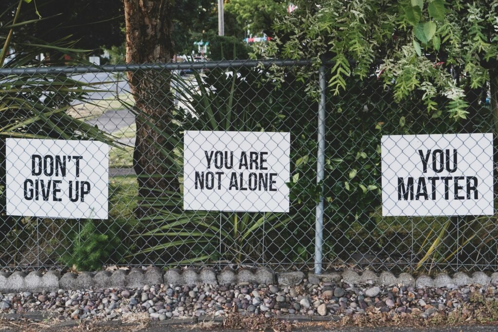 don't give up. You are not alone, you matter signage on metal fence